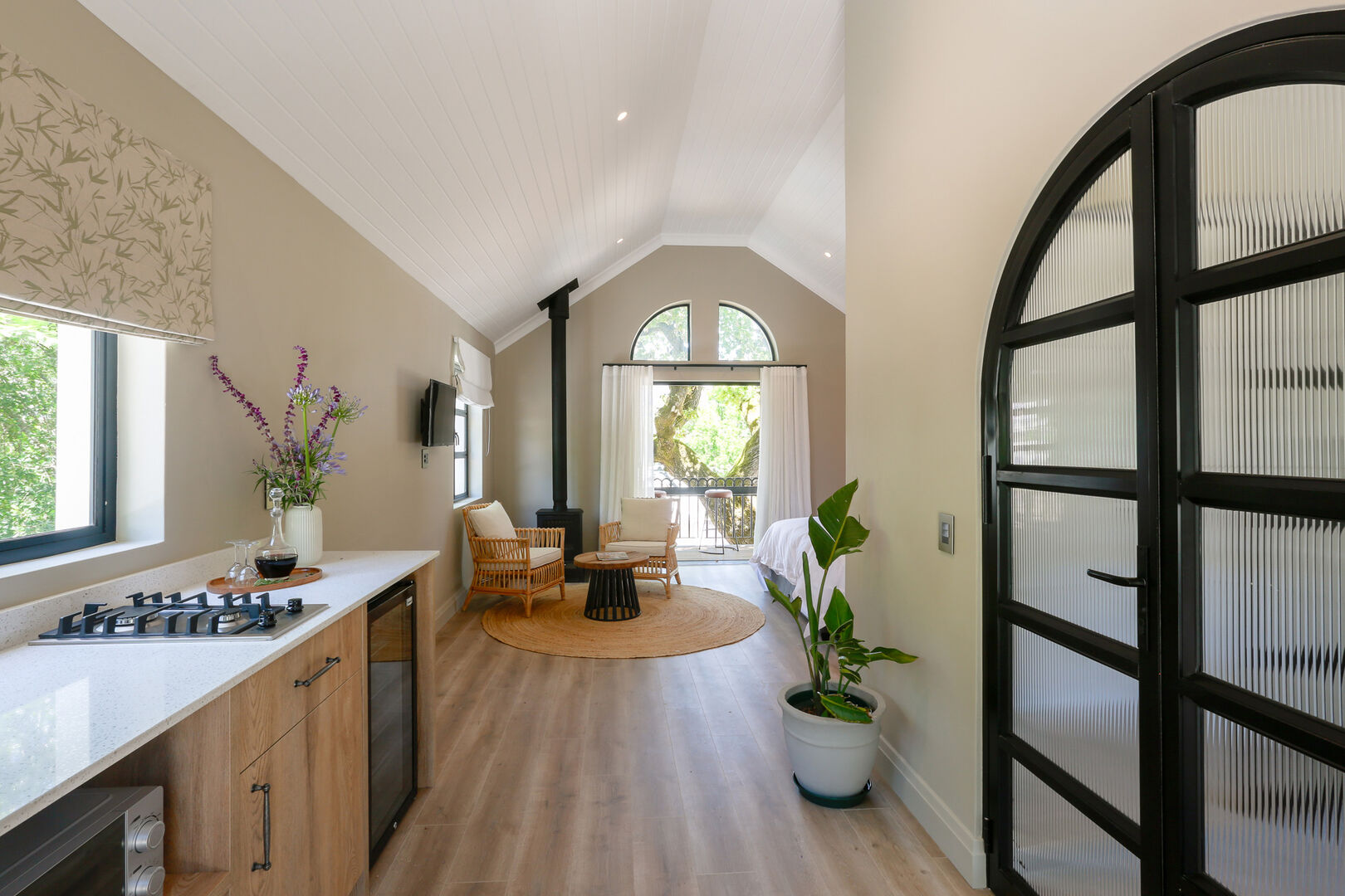 A luxury suite with a large living area and ensuite bathroom