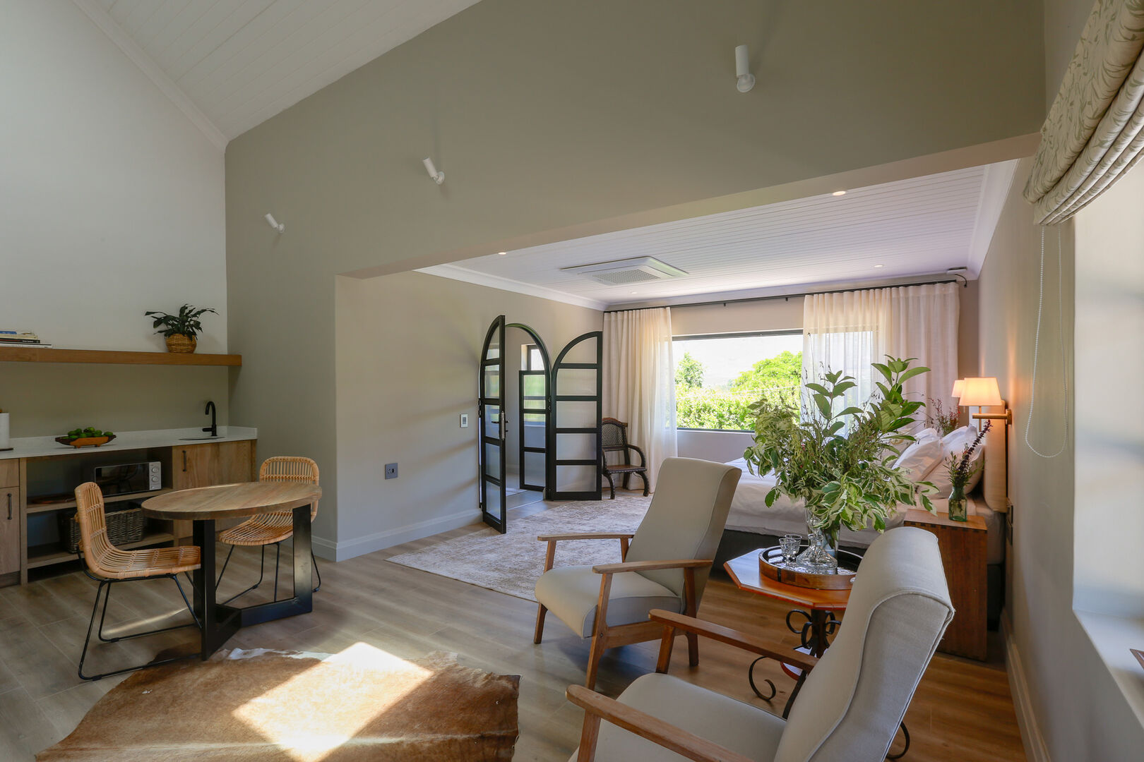 A luxury suite with a private sitting area and veranda